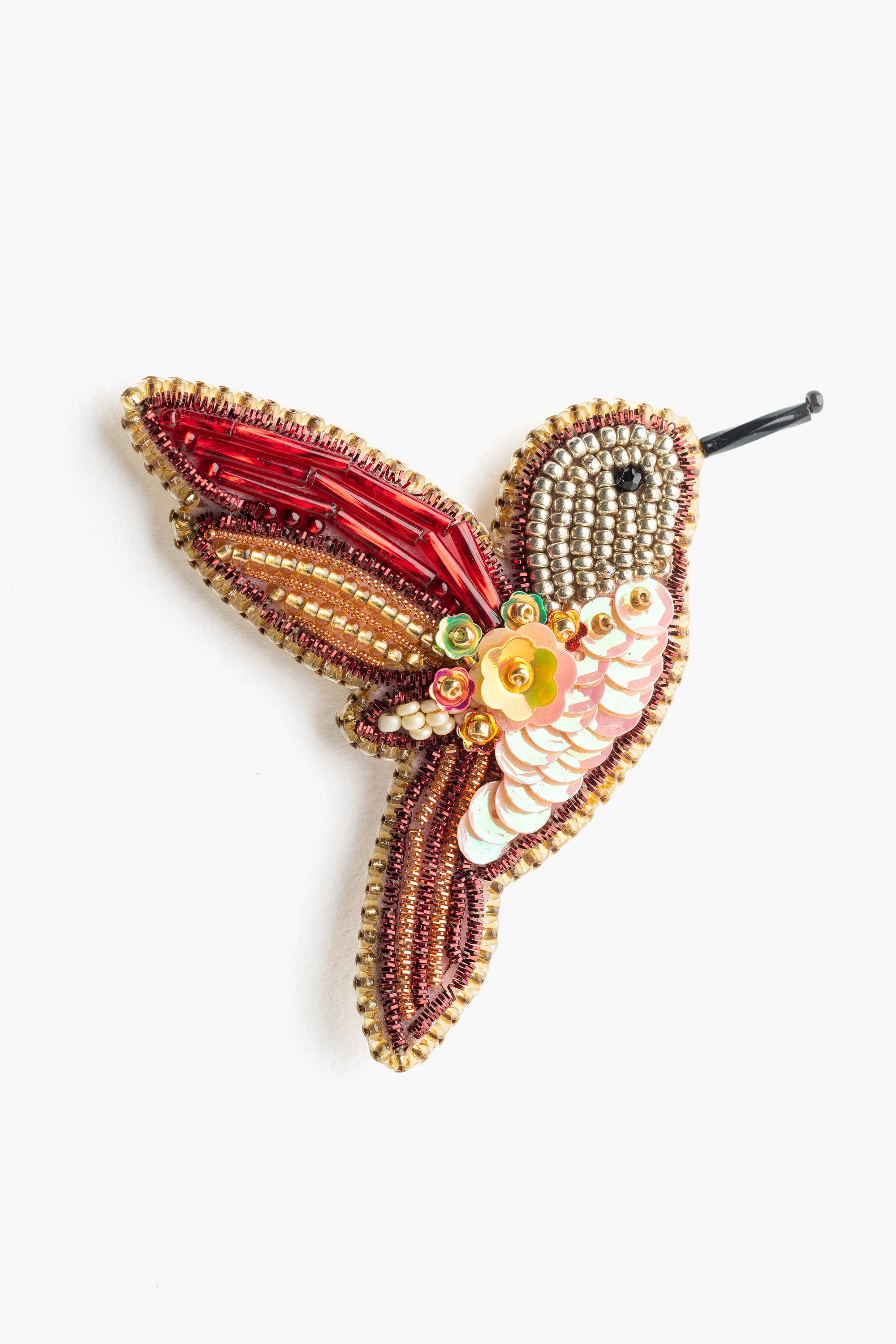 Broche en abalorios y lentejuelas