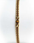 Pulsera hilos con dos bolitas de oro