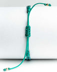 Pulsera hilos con dos bolitas de oro