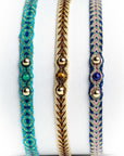 Pulsera hilos con dos bolitas de oro