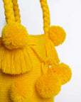 Bolso de hombro con pompones