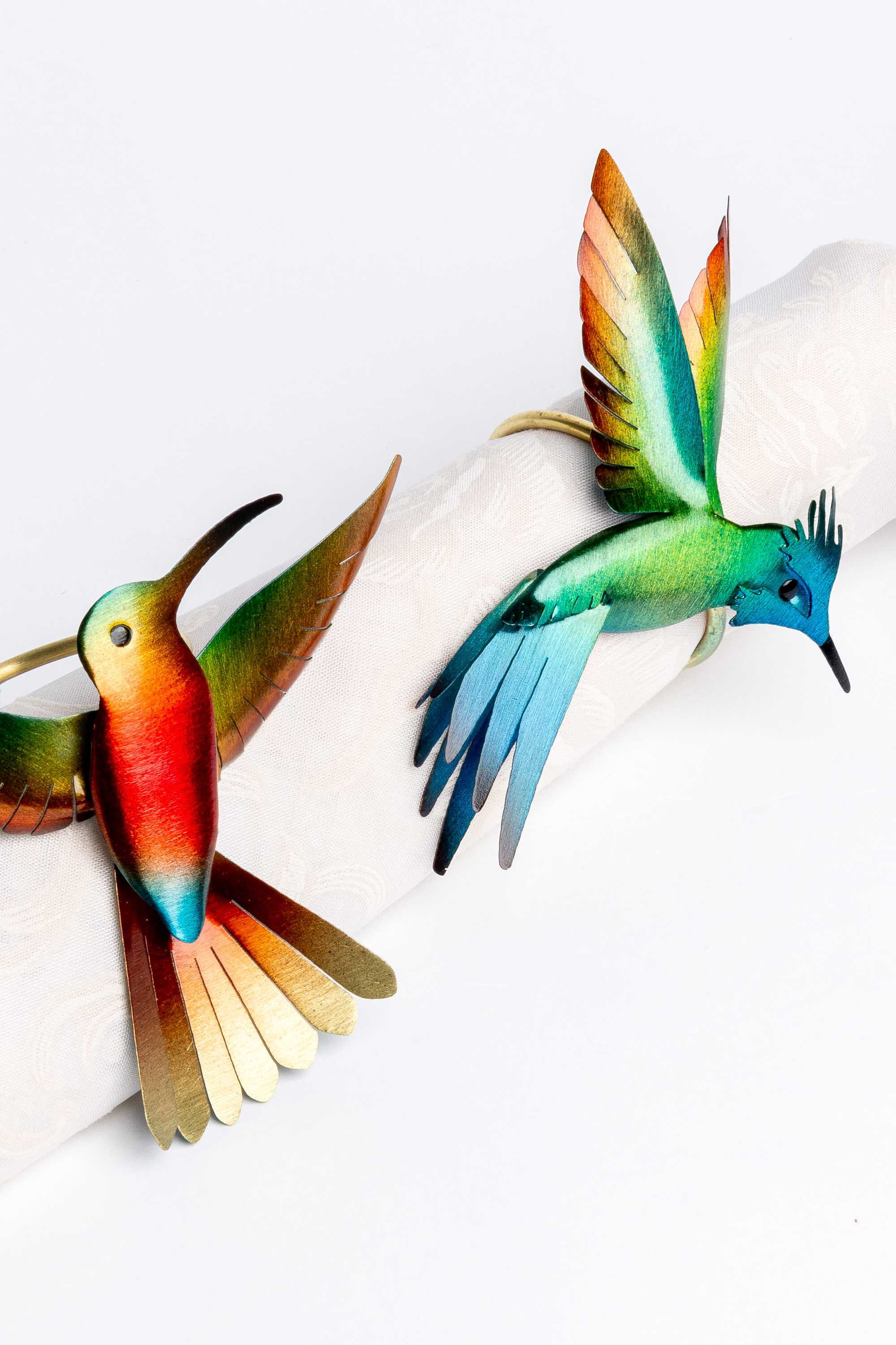 Juego de cuatro servilleteros en bronce