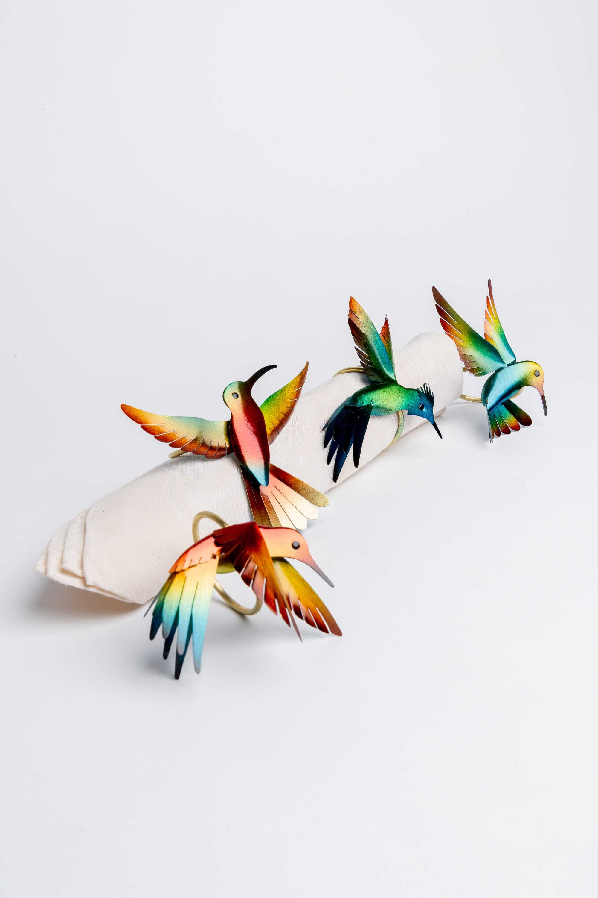 Juego de cuatro servilleteros en bronce