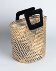 Bolso en fibra vegetal y asas en terciopelo