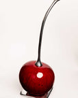 Cereza en fruto de totumo y peltre
