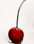 Cereza en fruto de totumo y peltre