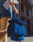 Bolso con pompones y borlas de algodón

